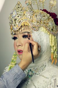 Portrait of smiling young woman in traditional clothing