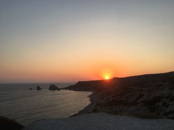 Scenic view of sea against clear sky during sunset