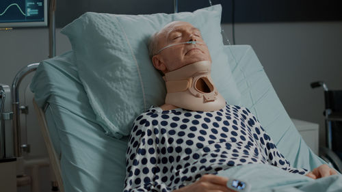 Patient sleeping on hospital bed