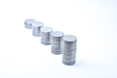 Close-up of coins on white background