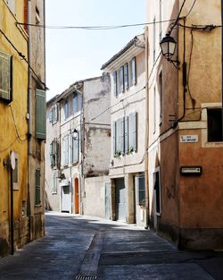 Narrow street amidst buildings in town