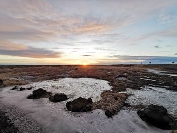 Scenic view of sea against sky during sunset