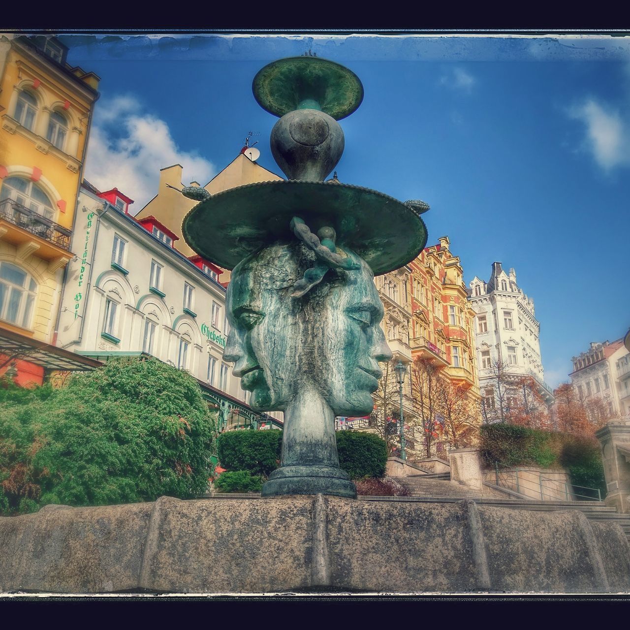 LOW ANGLE VIEW OF STATUES AGAINST SKY