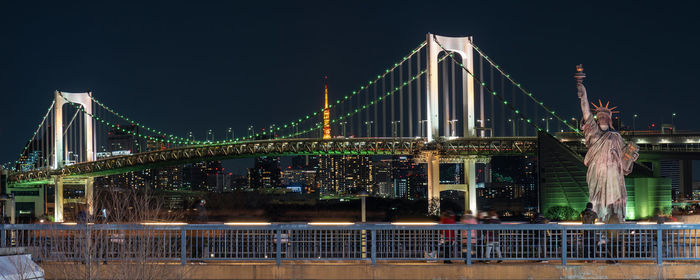 View of suspension bridge at night