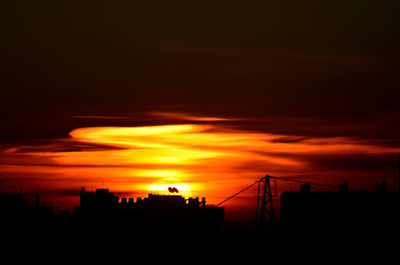 Scenic view of dramatic sky during sunset