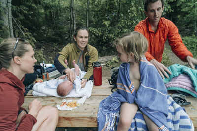 A family at a picnic table after swimming in lost lake, or.