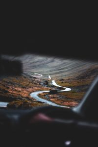 Close-up of airplane wing over sea