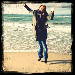 Woman standing on beach