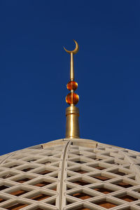 Low angle view of a building against blue sky