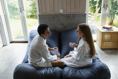 Couple relaxing together in living room