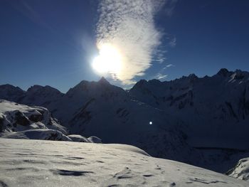 Scenic view of snowcapped mountains against sky