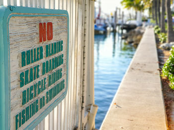 Close-up of pier against lake in city