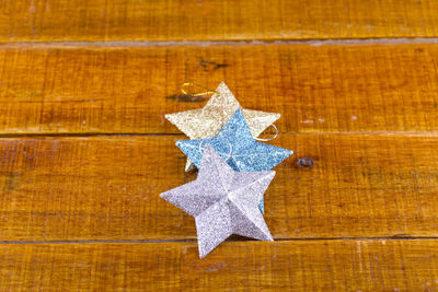 Close-up of christmas decoration on wood