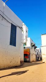 Buildings against clear blue sky