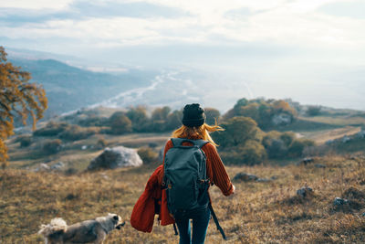 Rear view of woman looking at mountains