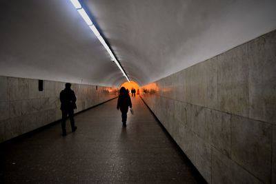 Full length of woman walking in tunnel