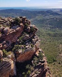 Rock formations on landscape against sky