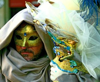 Close-up of couple wearing masks during carnival