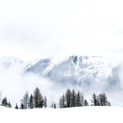 Scenic view of snow mountains against sky