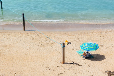 High angle view of woman relaxing on beach