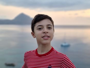 Portrait of man standing against sea