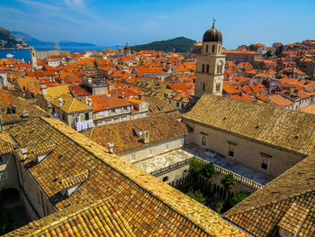 High angle view of buildings in town against sky