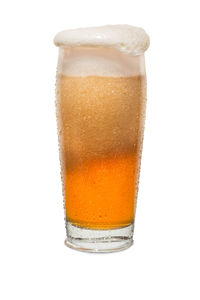 Close-up of beer glass against white background