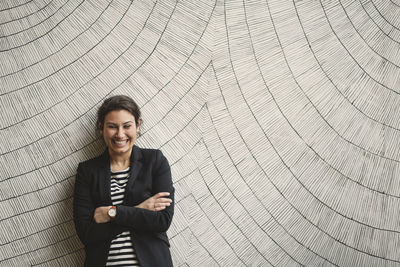 Portrait of a smiling young woman standing outdoors