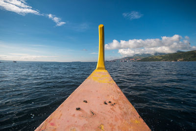 Close-up of yellow sea against sky