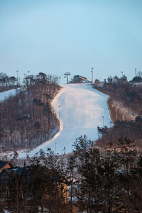 Ski slope at alpensia ski resort, pyeongchang, south korea against blue sky