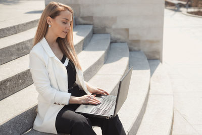 Young woman using mobile phone