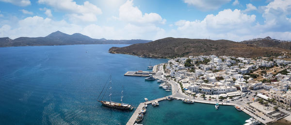 High angle view of sea and mountains against sky