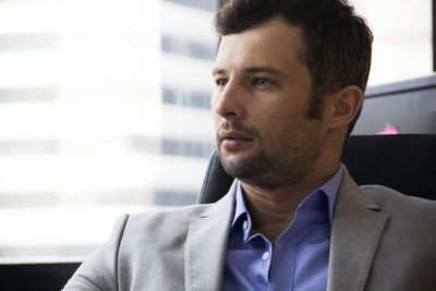 Portrait of young man looking away