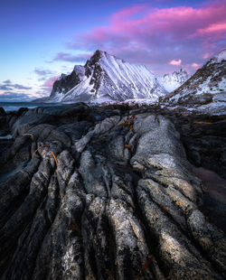 Scenic view of snowcapped mountains against sky