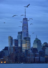 View of buildings in city at dusk