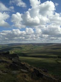 Scenic view of landscape against cloudy sky