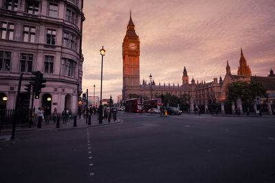 View of buildings in city at dusk