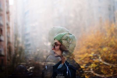 Portrait of boy looking away in forest