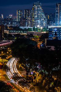 High angle view of illuminated buildings in city at night