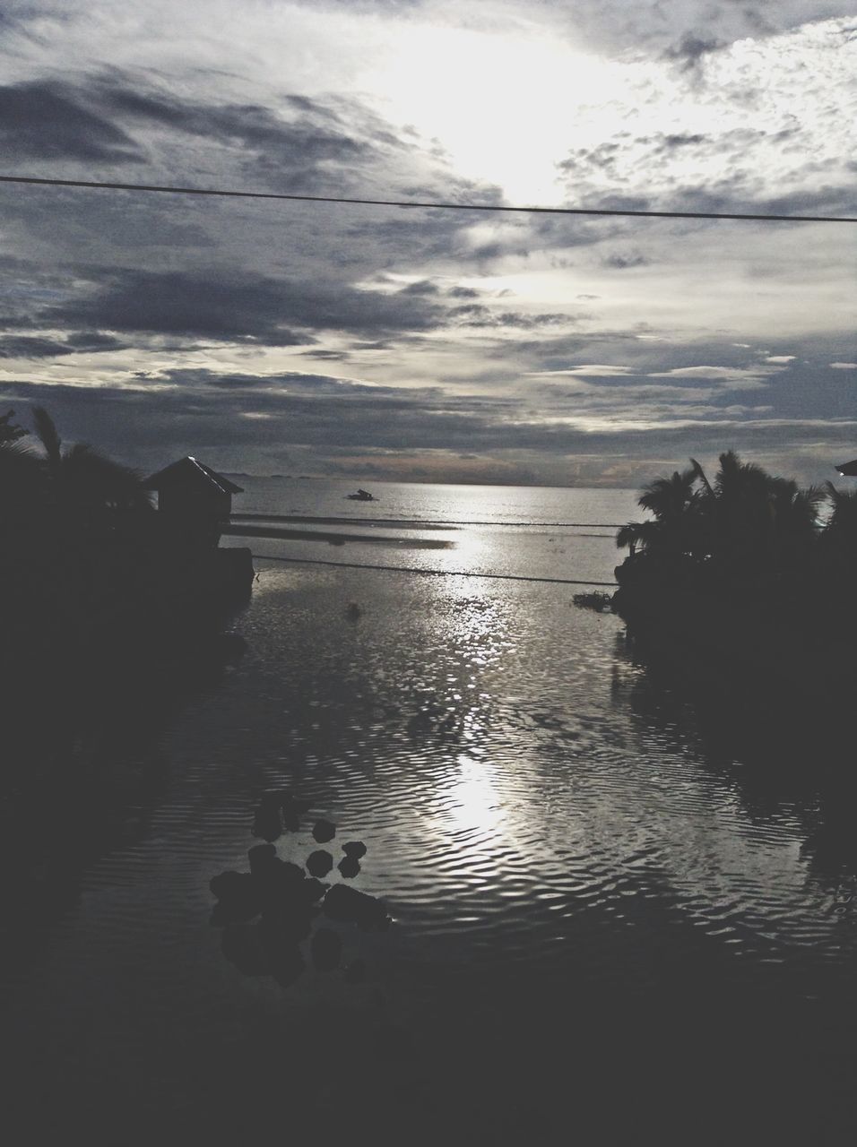 water, sea, tranquil scene, tranquility, sky, scenics, beauty in nature, horizon over water, reflection, nature, cloud - sky, beach, idyllic, sunset, shore, cloud, silhouette, sunlight, rock - object, outdoors