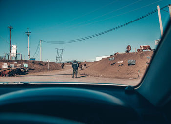 View of road against clear blue sky