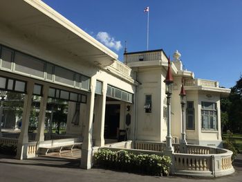 Low angle view of buildings against blue sky