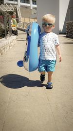 Full length of cute boy on sunny day