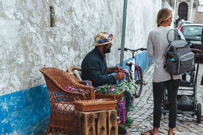 Rear view of people working in basket