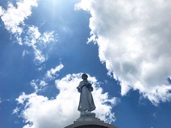 Low angle view of statue against sky