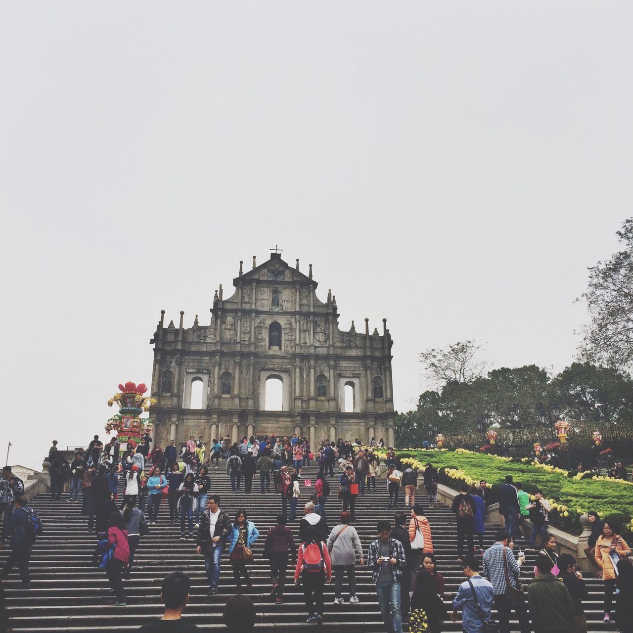 clear sky, architecture, large group of people, built structure, building exterior, copy space, person, tree, lifestyles, men, travel destinations, tourism, leisure activity, famous place, history, travel, religion, mixed age range, place of worship