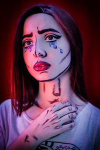 Painting on sad woman