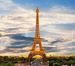 Communications tower against cloudy sky