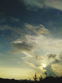 Low angle view of cloudy sky at sunset