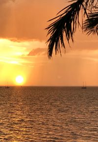 Scenic view of sea against orange sky